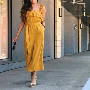 WOMENS YELLOW JUMPSUIT WITH BELT AND EYELIT DETAILING ON STRAPS AND DRESS